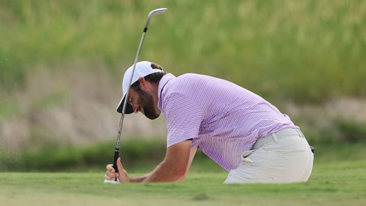 Scottie Scheffler reacts after a shot from a bunker on the 13th hole during the first round of the FedEx St. Jude Championship at TPC Southwind.