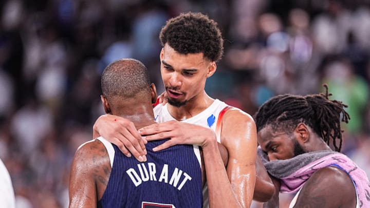 Victor Wembanyama of France (R) talks to Kevin Durant of United States (L) during the Men's Gold Medal Game, Game 50, match between France and United States on day fifteen of the Olympic Games Paris 2024 at Bercy Arena on August 10, 2024 in Paris, France