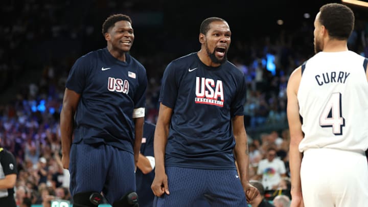  Anthony Edwards and Kevin Durant  celebrate with Stephen Curry during Team USA's basketball semifinal match against Serbia at the Paris Olympics.  