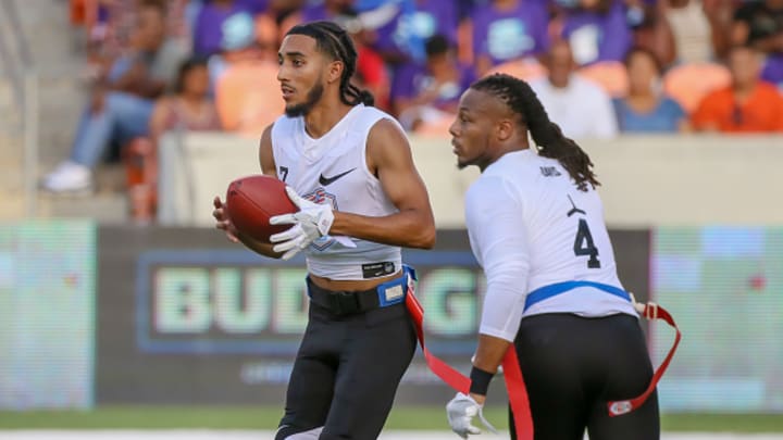 Fighting Cancer quarterback Darrell Doucette (7) prepares to hand the ball to Fighting Cancer wide receiver Darius Davis (4) during the American Flag Football League Ultimate Final game between the Fighting Cancer and Godspeed on July 19, 2018 at BBVA Compass Stadium in Houston, Texas. 