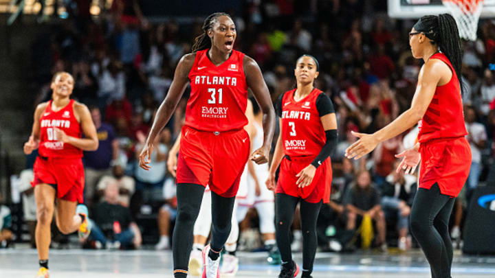 Atlanta Dream center Tina Charles celebrates with her teammates. 