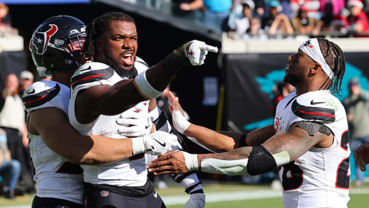 Azeez Al-Shaair #0 of the Houston Texans points to the Jacksonville Jaguars bench after a fight and being ejected during the second quarter of a game at EverBank Stadium on December 01, 2024 in Jacksonville, Florida. 