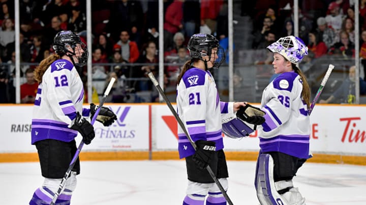 Kelly Pannek, Liz Schepers and Maddie Rooney (left to right) tap sticks during Game 2 of the PWHL finals.