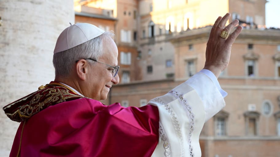 Pope Leo XIV waves to the Vatican crowd upon his election. | Francesco Sforza - Vatican Media via Vatican Pool/Getty Images