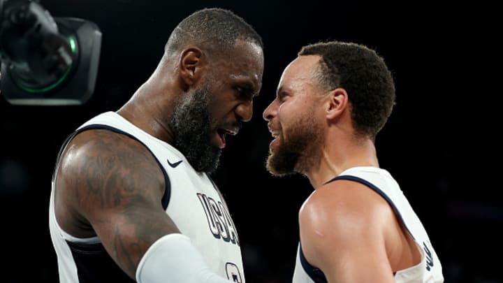 LeBron James and Stephen Curry celebrate Team USA's win against Serbia at the 20224 Olympics