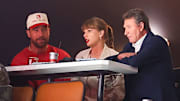 Travis Kelce, Taylor Swift and Wayne Gretzky, from left, sit together during the second period as the Edmonton Oilers and the Florida Panthers play in Game Four of the 2025 Stanley Cup Final at Amerant Bank Arena on June 12, 2025 in Sunrise, Florida. 