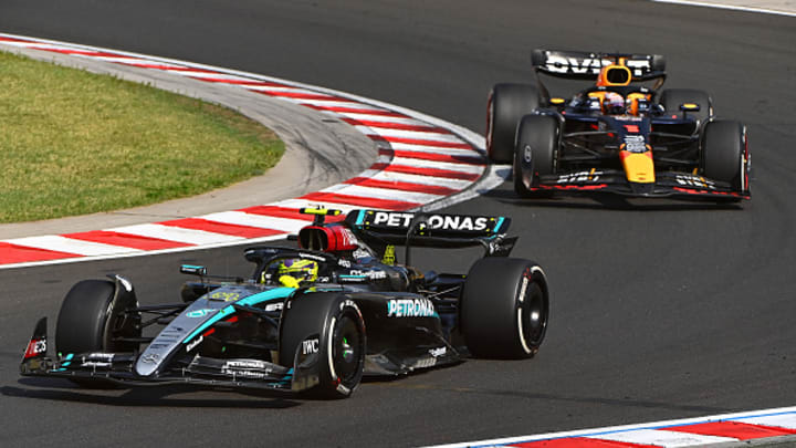 Lewis Hamilton of Great Britain driving the (44) Mercedes AMG Petronas F1 Team W15 leads Max Verstappen of the Netherlands driving the (1) Oracle Red Bull Racing RB20 on track during the F1 Grand Prix of Hungary at Hungaroring on July 21, 2024 in Budapest, Hungary.