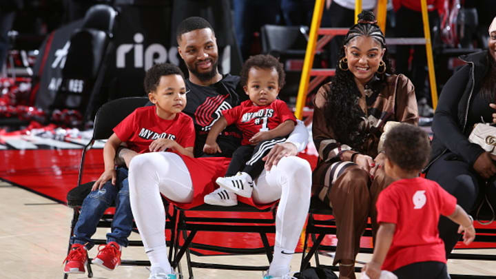 Damian Lillard of the Portland Trail Blazers smiles with his family after a 2022 game against the Charlotte Hornets at the Moda Center Arena in Portland, Oregon.