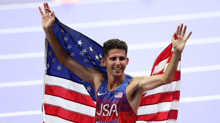 Bronze medalist Grant Fisher of Team United States celebrates after the Men's 10,000m Final on day seven of the Olympic Games Paris 2024 at Stade de France on August 02, 2024 in Paris, France.