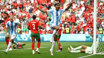 Cristian Medina of Argentina celebrates scoring his team's second goal during the Men's group B match between Argentina and Morocco during the Olympic Games Paris 2024 at Stade Geoffroy-Guichard on July 24, 2024 in Saint-Etienne, France.