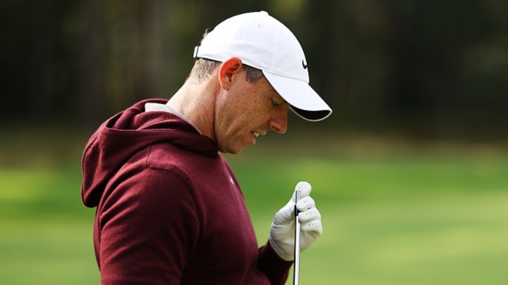 Rory McIlroy looks at his iron after the club head flew off during Day One of the BMW PGA Championship. Rory McIlroy looks at his iron after the club head flew off during Day One of the BMW PGA Championship.