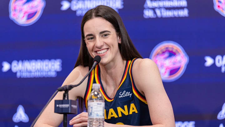 Caitlin Clark #22 of the Indiana Fever talks to reporters during media day activities at Gainbridge Fieldhouse on May 1, 2024 in Indianapolis, Indiana.