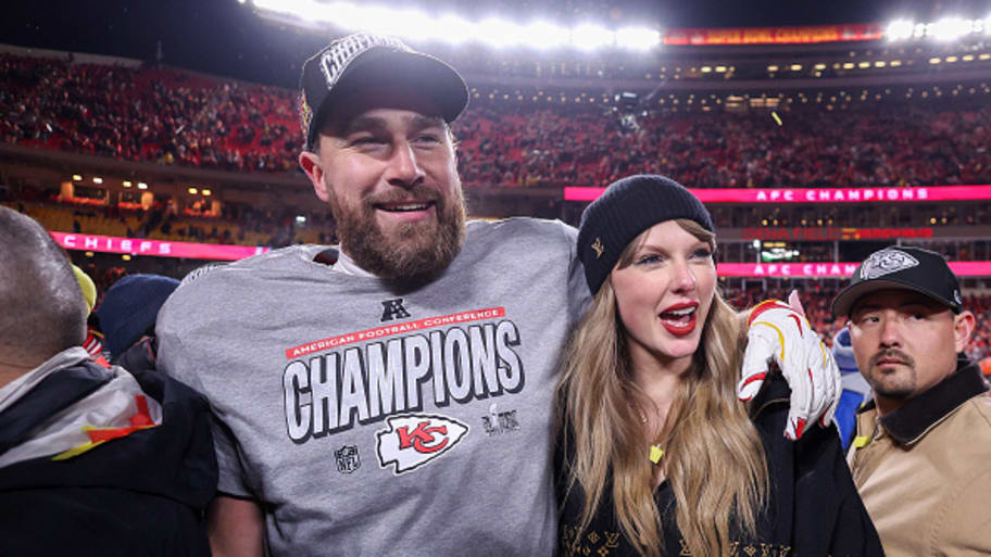 Taylor Swift celebrates with Travis Kelce of the Kansas City Chiefs after defeating the Buffalo Bills 32-29 in the AFC Championship Game at GEHA Field at Arrowhead Stadium.  | Photo by Jamie Squire/Getty Images