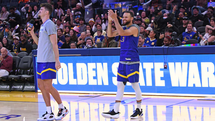 Post performs a song while Curry looks on during a Warriors open practice in October. Post performs a song while Curry looks on during a Warriors open practice in October.