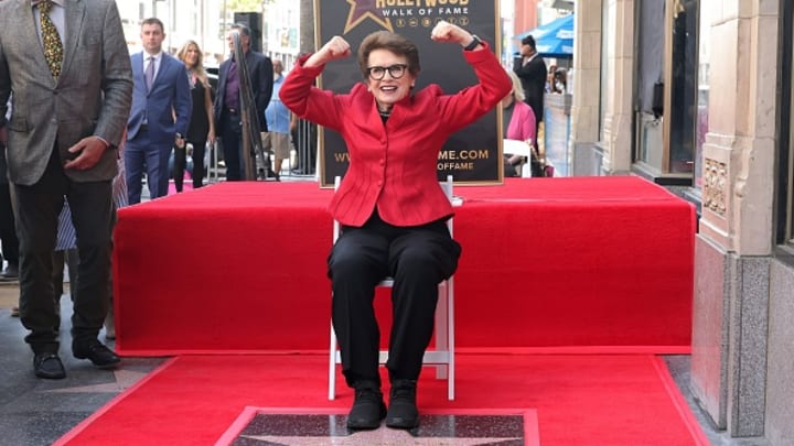 Billie Jean King poses with her star on the Hollywood Walk of Fame. Billie Jean King poses with her star on the Hollywood Walk of Fame.