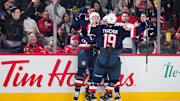 Team USA stars Brady Tkachuk and Matthew Tkachuk celebrate a goal against Finland at the 4-Nations Face-Off