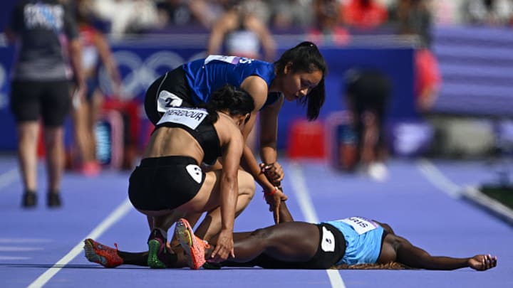 Silina Pha Aphay and Valentina Meredova comfort Lucia Moris who suffered an injury at Paris Olympics.