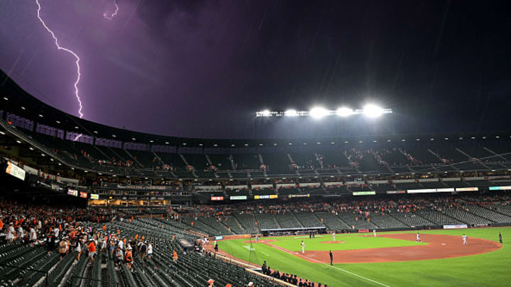 Lightning strikes at Orioles Park on Friday night during the Rockies-Orioles game. Lightning strikes at Orioles Park on Friday night during the Rockies-Orioles game.