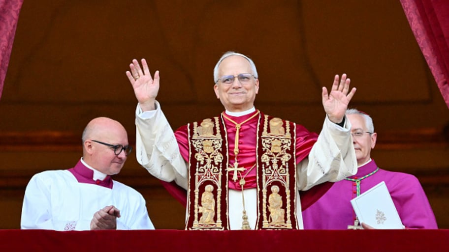 Pope Leo XIV greets the world upon his election. | ALBERTO PIZZOLI/AFP via Getty Images