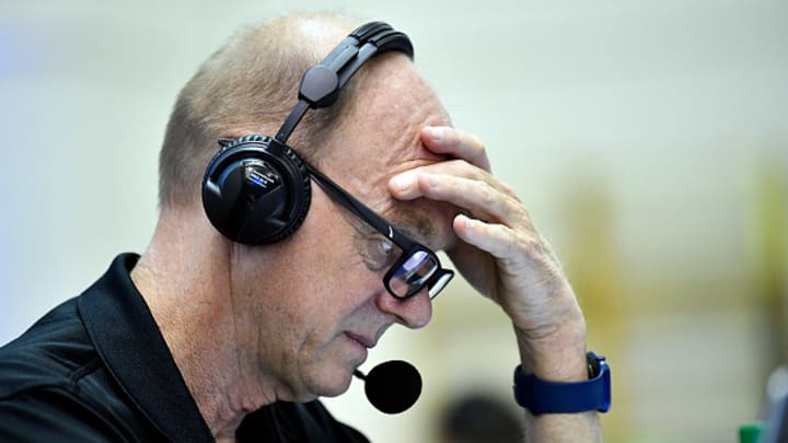 Olympic gold medalist and professional commentator Rowdy Gaines looks on at a swimming event.