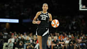 LAS VEGAS, NEVADA - OCTOBER 04: A'ja Wilson #22 of the Las Vegas Aces brings the ball up the court against the New York Liberty in the second quarter of Game Three of the 2024 WNBA Playoffs semifinals at Michelob ULTRA Arena on October 04, 2024 in Las Vegas, Nevada. 