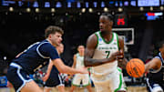 Mar 21, 2025; Seattle, WA, USA; Oregon Ducks forward Supreme Cook (7) dribbles the ball against the Liberty Flames during the second half in the first round of the NCAA Tournament at Climate Pledge Arena. Mandatory Credit: Steven Bisig-Imagn Images