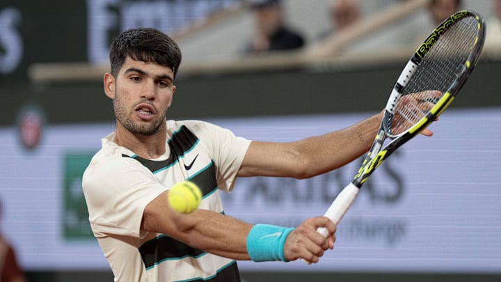 Jun 6, 2025; Paris, FR; Carlos Alcaraz of Spain returns a shot during his match against Lorenzo Musetti of Italy match on day 13 at Roland Garros Stadium. Mandatory Credit: Susan Mullane-Imagn Images Jun 6, 2025; Paris, FR; Carlos Alcaraz of Spain returns a shot during his match against Lorenzo Musetti of Italy match on day 13 at Roland Garros Stadium. Mandatory Credit: Susan Mullane-Imagn Images