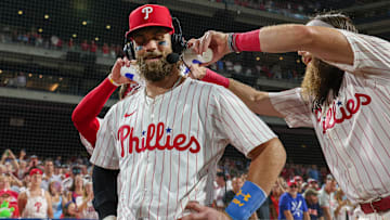 Philadelphia Phillies first baseman Bryce Harper getting water poured on him during a postgame interview