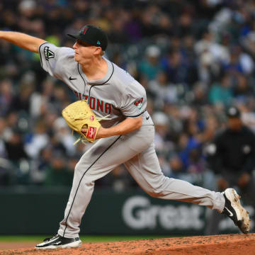 Apr 26, 2024; Seattle, Washington, USA; Arizona Diamondbacks relief pitcher Scott McGough (30) pitches to the Seattle Mariners during the sixth inning at T-Mobile Park. Mandatory Credit: Steven Bisig-USA TODAY Sports
