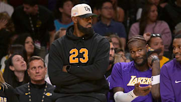 Oct 12, 2025; Los Angeles, California, USA;  Los Angeles Lakers forward Lebron James (23) looks on from the bench during the first half against the Golden State Warriors at Crypto.com Arena. Mandatory Credit: Jayne Kamin-Oncea-Imagn Images