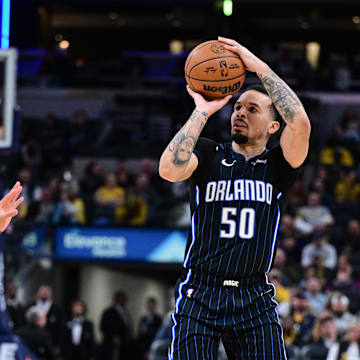 Orlando Magic guard Cole Anthony shoots the ball over Indiana Pacers guard RayJ Dennis.