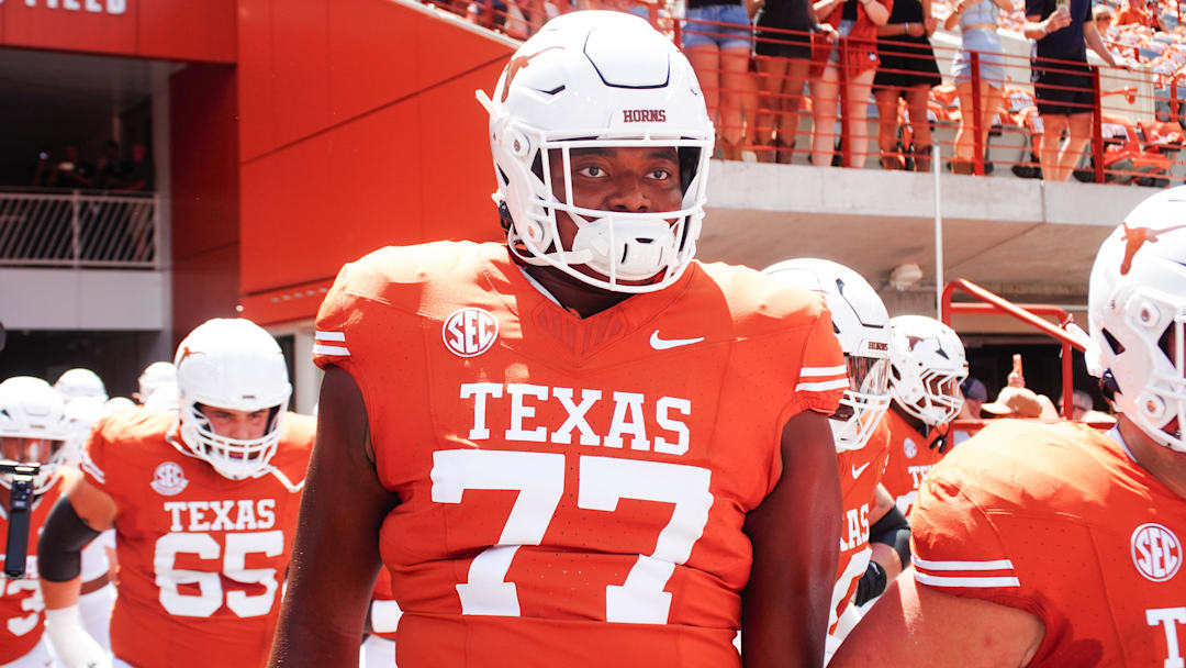 Aug 31, 2024; Austin, Texas, USA; Texas Longhorns lineman Andre Cojoe (77) runs out onto the field before a game at Darrell K Royal-Texas Memorial Stadium. Mandatory Credit: Aaron Meullion-Imagn Images