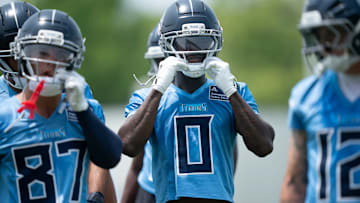 Calvin Ridley straps on his helmet for drills during mandatory Titans Minicamp.