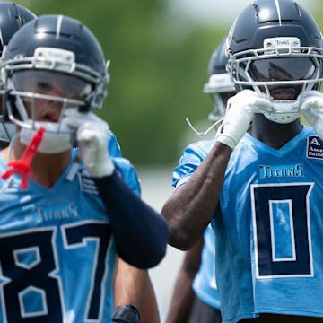 Calvin Ridley straps on his helmet for drills during mandatory Titans Minicamp.