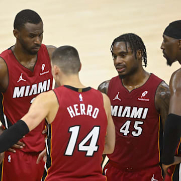 Apr 20, 2025; Cleveland, Ohio, USA; The Miami Heat gather in front of the bench during a timeout in the fourth quarter against the Cleveland Cavaliers at Rocket Arena. Mandatory Credit: David Richard-Imagn Images