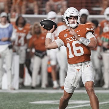 Sep 14, 2024; Austin, Texas, USA; Texas Longhorns quarterback Arch Manning (16) throws a touchdown pass during the second half against the Texas-San Antonio Roadrunners at Darrell K Royal-Texas Memorial Stadium. Mandatory Credit: Scott Wachter-Imagn Images