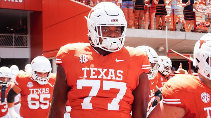 Aug 31, 2024; Austin, Texas, USA; Texas Longhorns lineman Andre Cojoe (77) runs out onto the field before a game at Darrell K Royal-Texas Memorial Stadium. Mandatory Credit: Aaron Meullion-Imagn Images