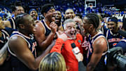 Auburn coach Bruce Pearl celebrates with his players after beating Kentucky on Saturday.