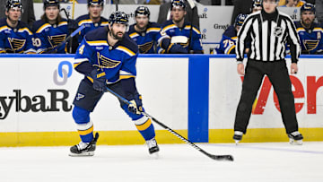 Feb 4, 2025; St. Louis, Missouri, USA;  St. Louis Blues defenseman Nick Leddy (4) controls the puck against the Edmonton Oilers during the second period at Enterprise Center. Mandatory Credit: Jeff Curry-Imagn Images
