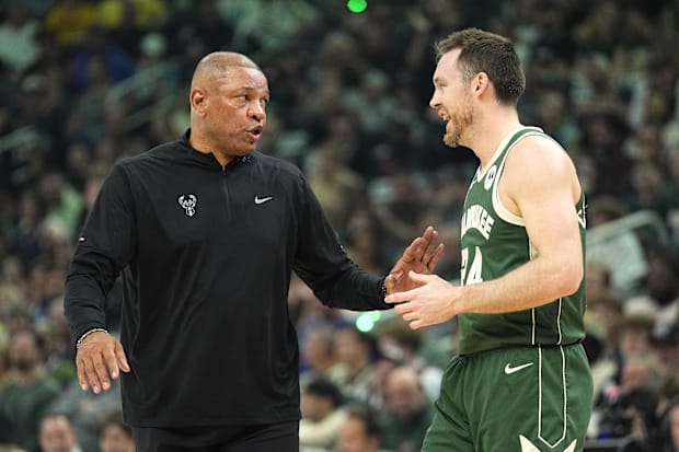 Milwaukee Bucks head coach Doc Rivers talks with guard Pat Connaughton (24) during a 2024 NBA playoff game against Indiana.