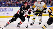 Jan 17, 2025; Buffalo, New York, USA;  Buffalo Sabres center Dylan Cozens (24) skates up ice with the puck during the second period against the Pittsburgh Penguins at KeyBank Center. Mandatory Credit: Timothy T. Ludwig-Imagn Images