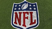 General view of the NFL shield logo on the field at the Tom Benson Hall of Fame Stadium site of the Professional Football Hall of Fame game and Class of 2025 induction ceremonies. 