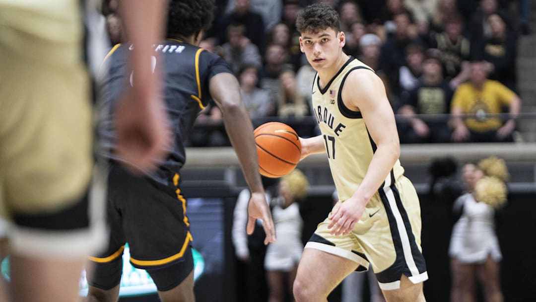 Purdue Boilermakers guard Omer Mayer (17) dribbles the ball Purdue Boilermakers guard Omer Mayer (17) dribbles the ball