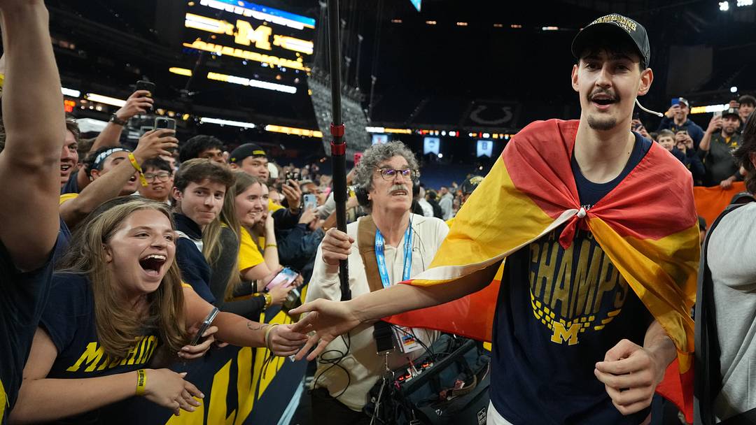 Apr 6, 2026; Indianapolis, IN, USA; Michigan Wolverines center Aday Mara (15) with fans after the National Championship of the Final Four of the men's 2026 NCAA Tournament at Lucas Oil Stadium.