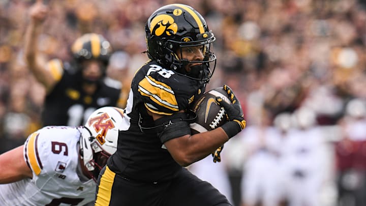 Oct 25, 2025; Iowa City, Iowa, USA; Iowa Hawkeyes running back Kamari Moulton (28) runs the ball against the Minnesota Golden Gophers during the first quarter at Kinnick Stadium. Mandatory Credit: Jeffrey Becker-Imagn Images