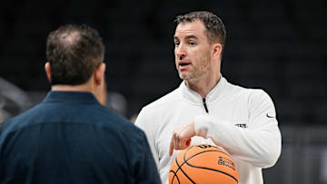 Mar 21, 2024; Indianapolis, IN, USA; Utah State Aggies head coach Danny Sprinkle is seen during the NCAA tournament practice day at Gainbridge FieldHouse. Mandatory Credit: Robert Goddin-Imagn Images