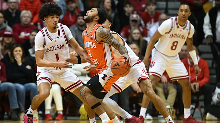 Jan 14, 2025; Bloomington, Indiana, USA; Illinois Fighting Illini guard Kylan Boswell (4) dribbles against Indiana Hoosiers guard Myles Rice (1) during the first half.