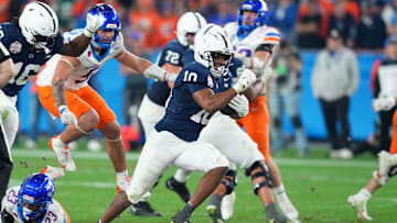 Penn State Nittany Lions running back Nicholas Singleton (10) rushes for a touchdown against the Boise State Broncos during the second half in the Fiesta Bowl at State Farm Stadium. 