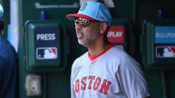 Boston Red Sox manager Alex Cora (13) stands in the dugout during the eighth inning of a game against the Washington Nationals at Nationals Park.