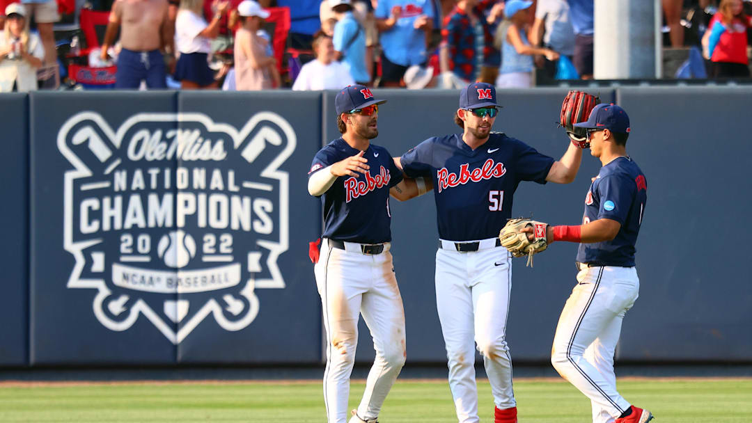 Jun 1, 2025; Oxford, MS, USA; Mississippi Rebels outfielders Mitchell Sanford (4), Isaac Humphrey (51) and Hayden Federico (9) react after defeating the Georgia Tech Yellowjackets. Mandatory Credit: Petre Thomas-Imagn Images